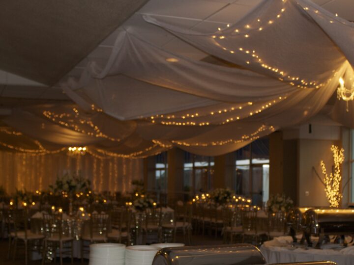 Lighted ceiling drapes over a reception at the Pensacola Yacht Club