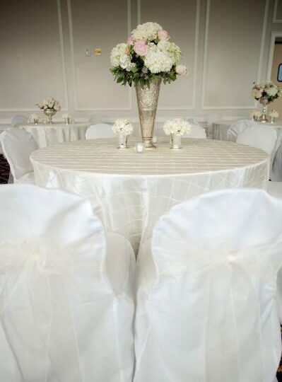 NAS Mustin Beach Officers Club — All white wedding — White pin tuck table cloths, white chair covers, and white sheer…