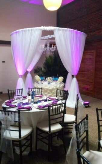 Up lighting by Dance n' Glow of Pensacola. Round Chuppah for bridal table.